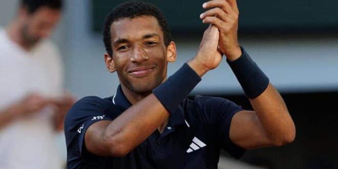 Felix Auger-Aliassime claps his hands
