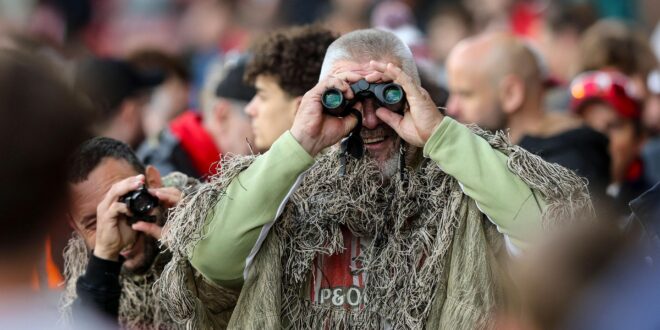 A Southampton fan in camouflage attire during the second leg of his side's Championship semi-final against Middlesbrough